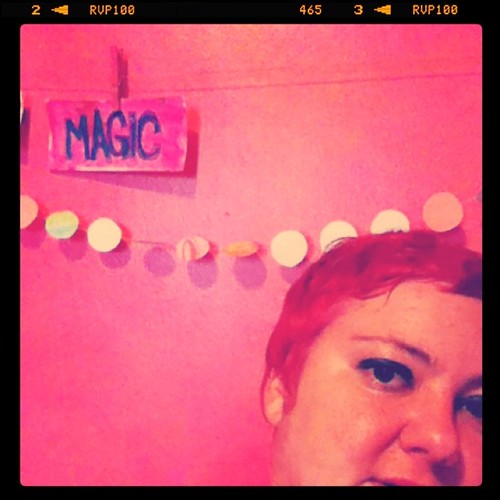 Pink hair in pink room.